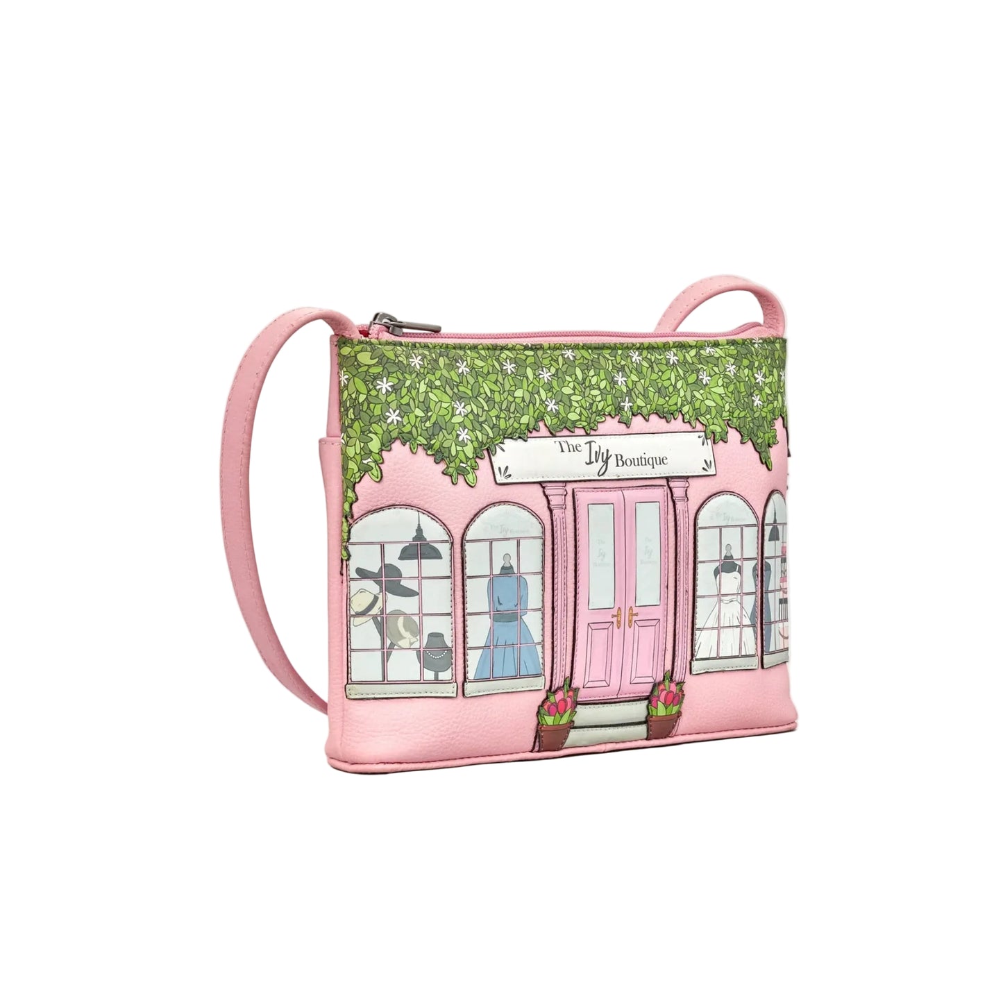Pink crossbody bag with a store front design on a white background